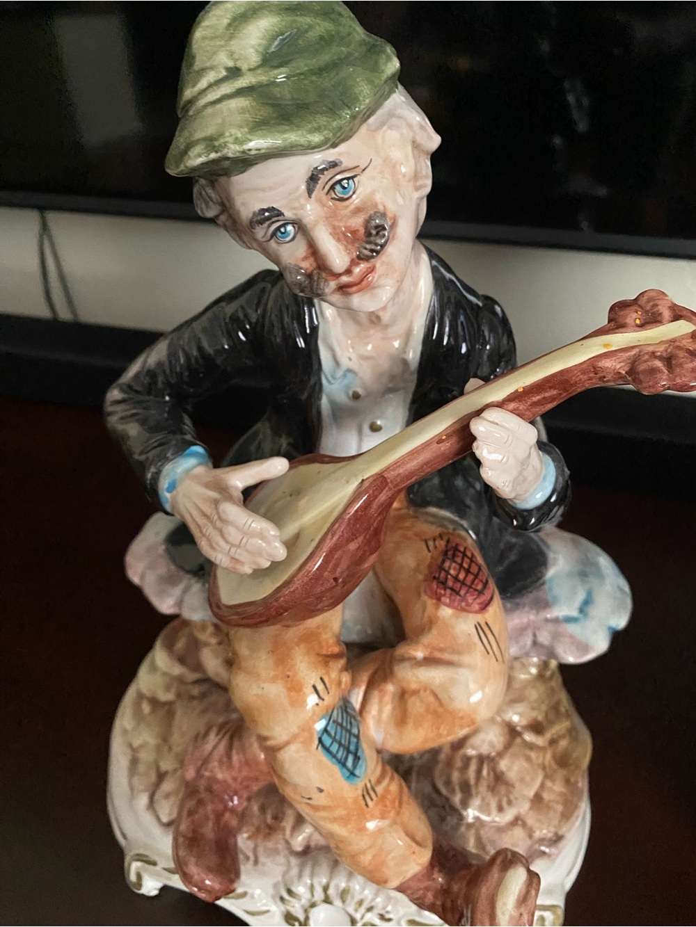 Hand-Painted Porcelain Musician Figurine - Green, Black & Tan